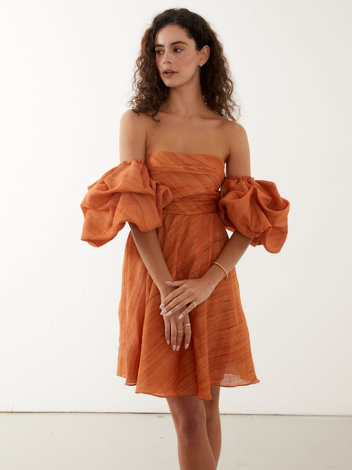 mini dress in papaya orange with statement off the shoulder sleeves