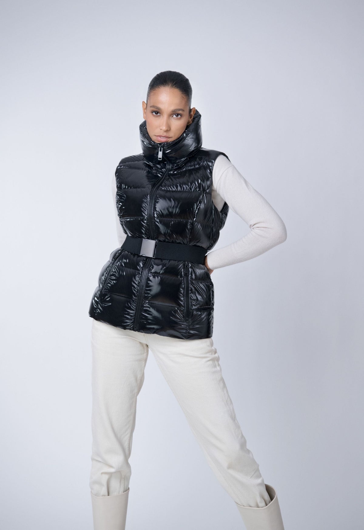 shiny black belted puffer vest made from repurposed down
