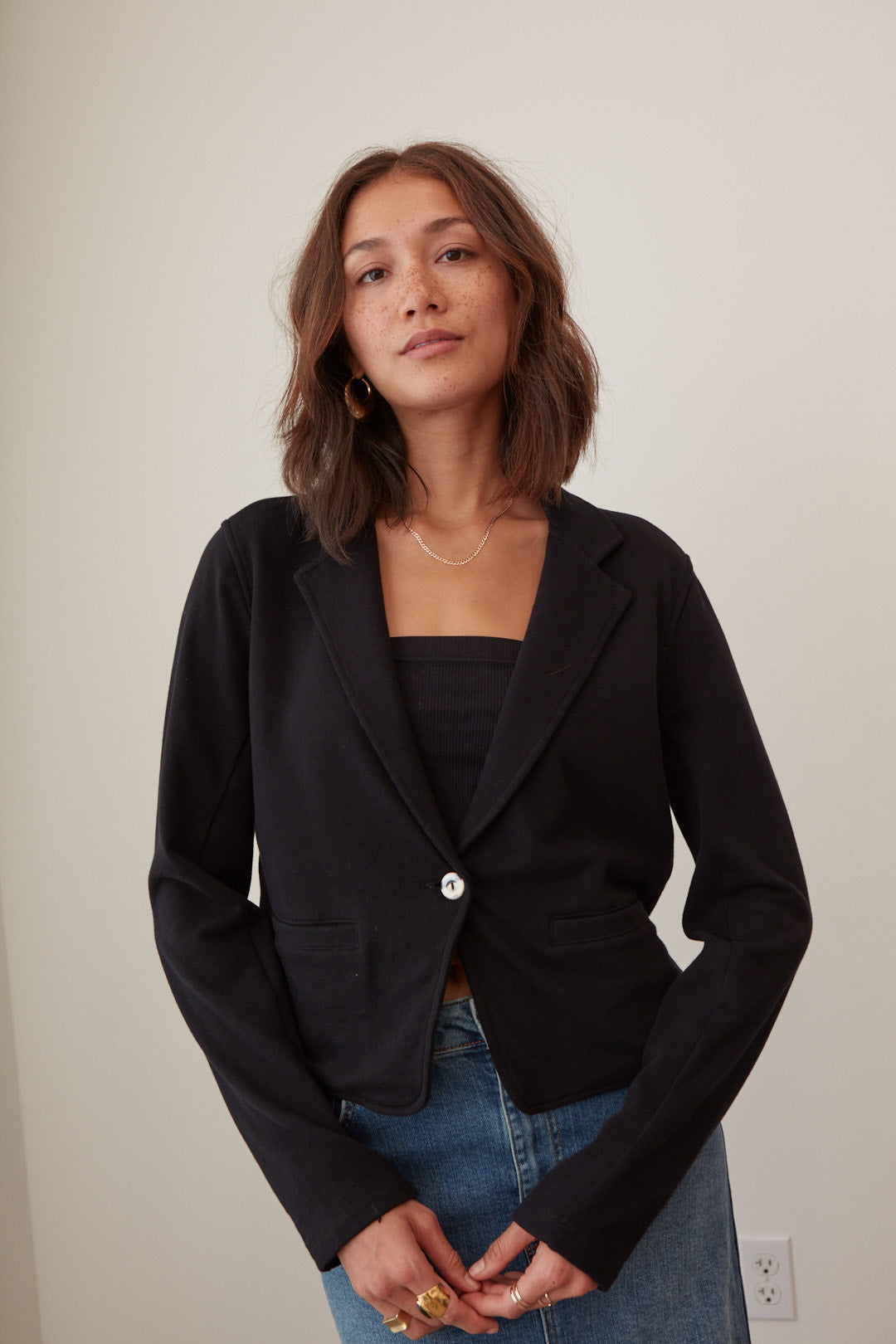 eco conscious fashion brand simple black blazer for women