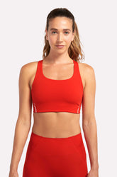 sustainable sports bra with mid support in a statement red color