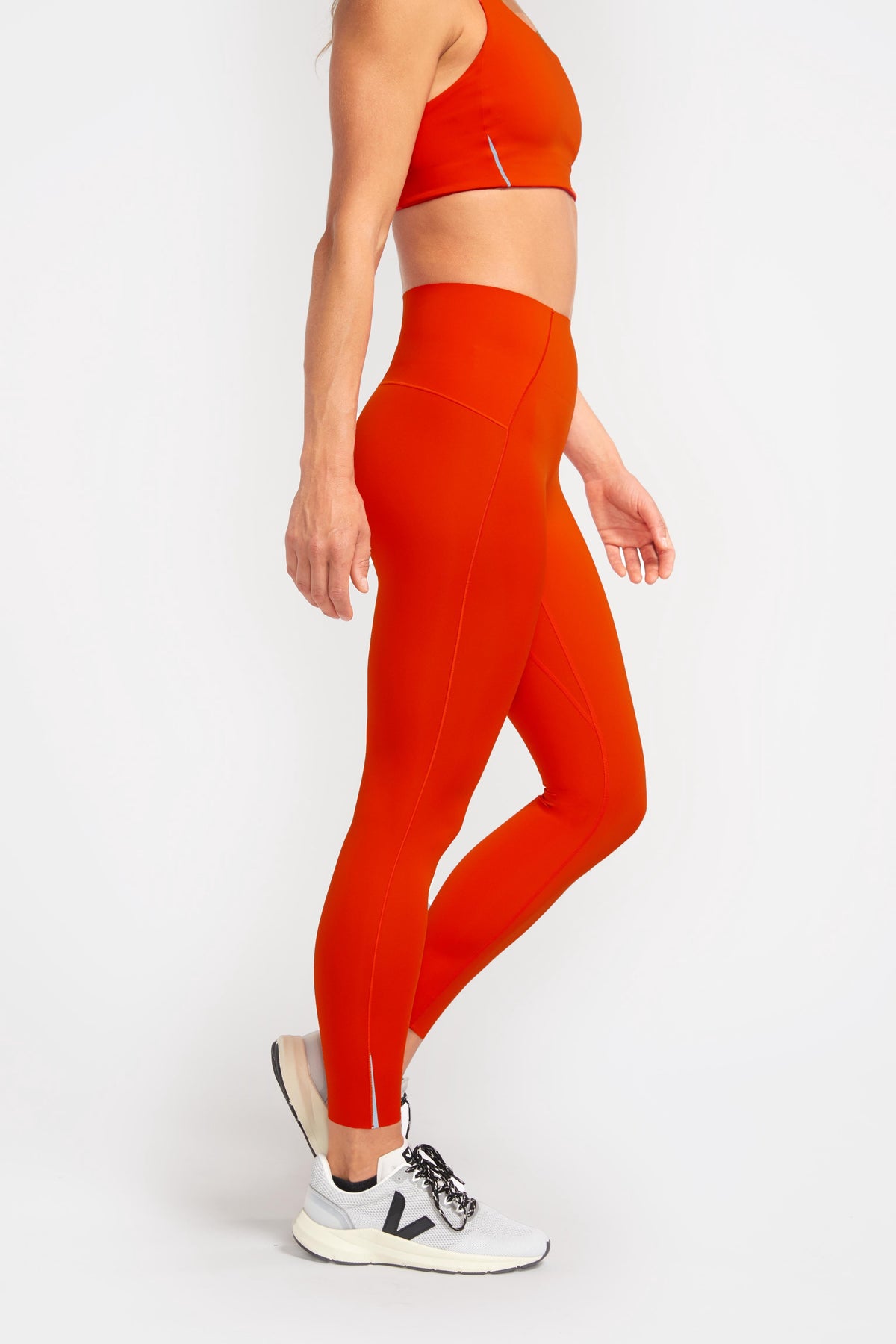 side view high waisted eco conscious red leggings