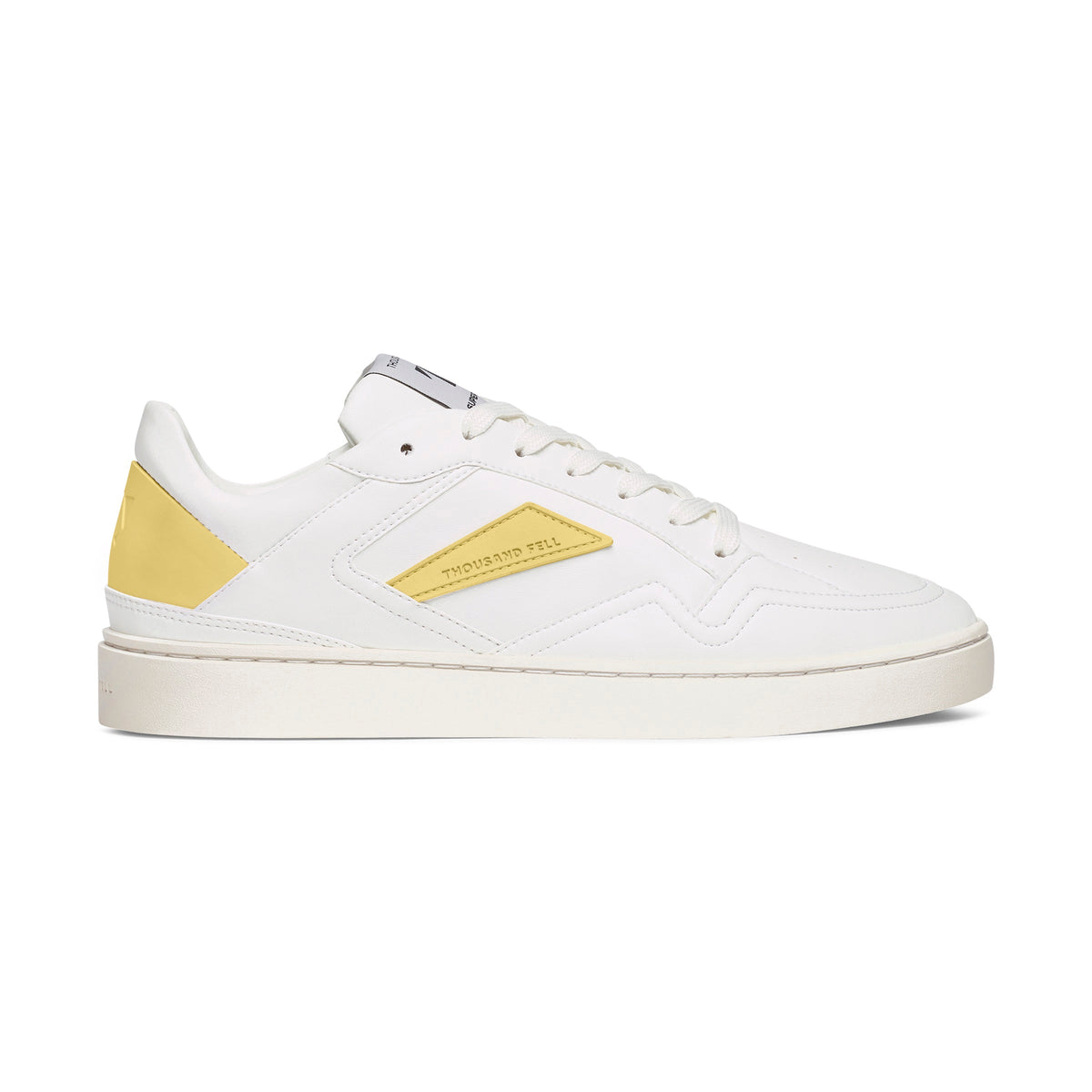 sustainable sneaker featuring white breathable recycled upper with yellow details