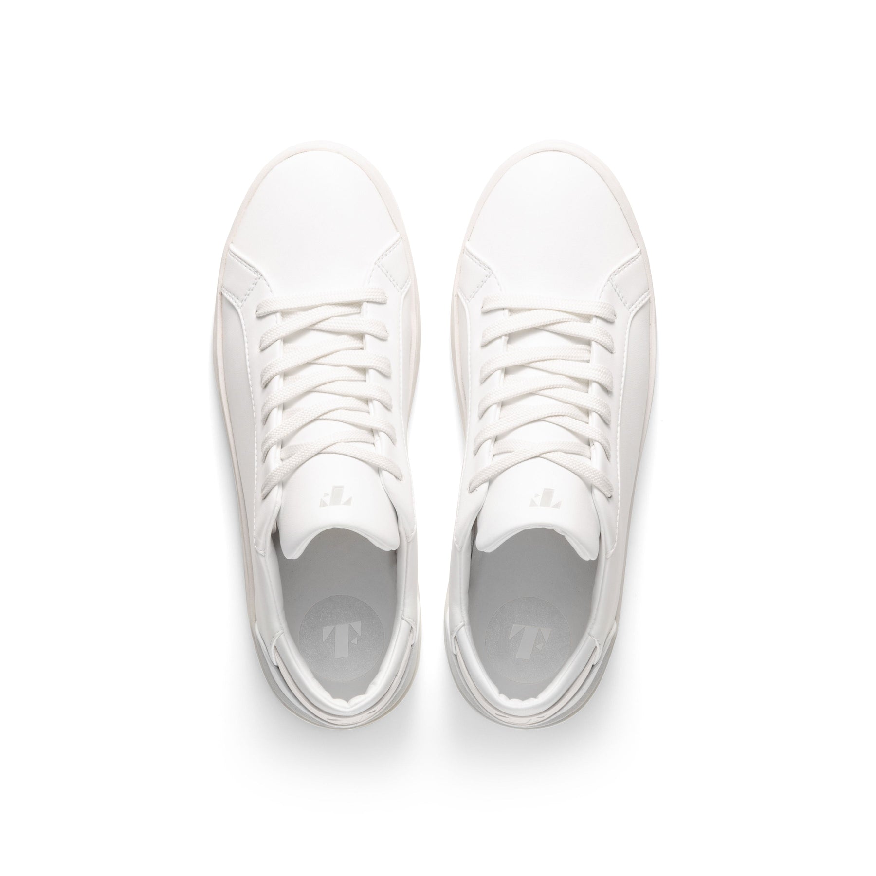 top view of classic white sneakers with vegan leather