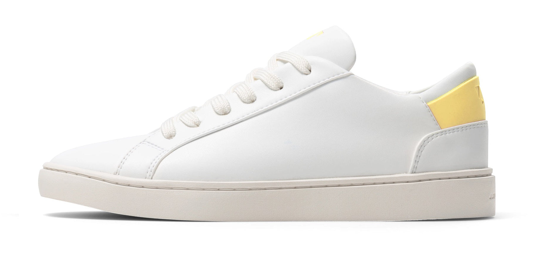 side view of vegan leather sneakers in white with yellow details