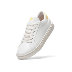 vegan leather sustainable sneakers in white with yellow details