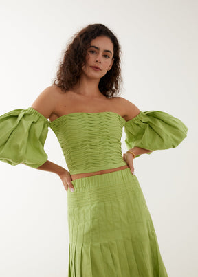 lime green resortwear cropped top with statement off the shoulder sleeves and maxi linen skirt