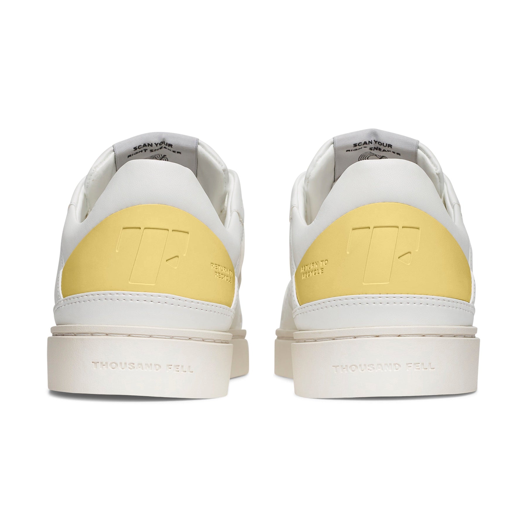 back view of white sustainable alternative to nike shoes with pastel yellow details 
