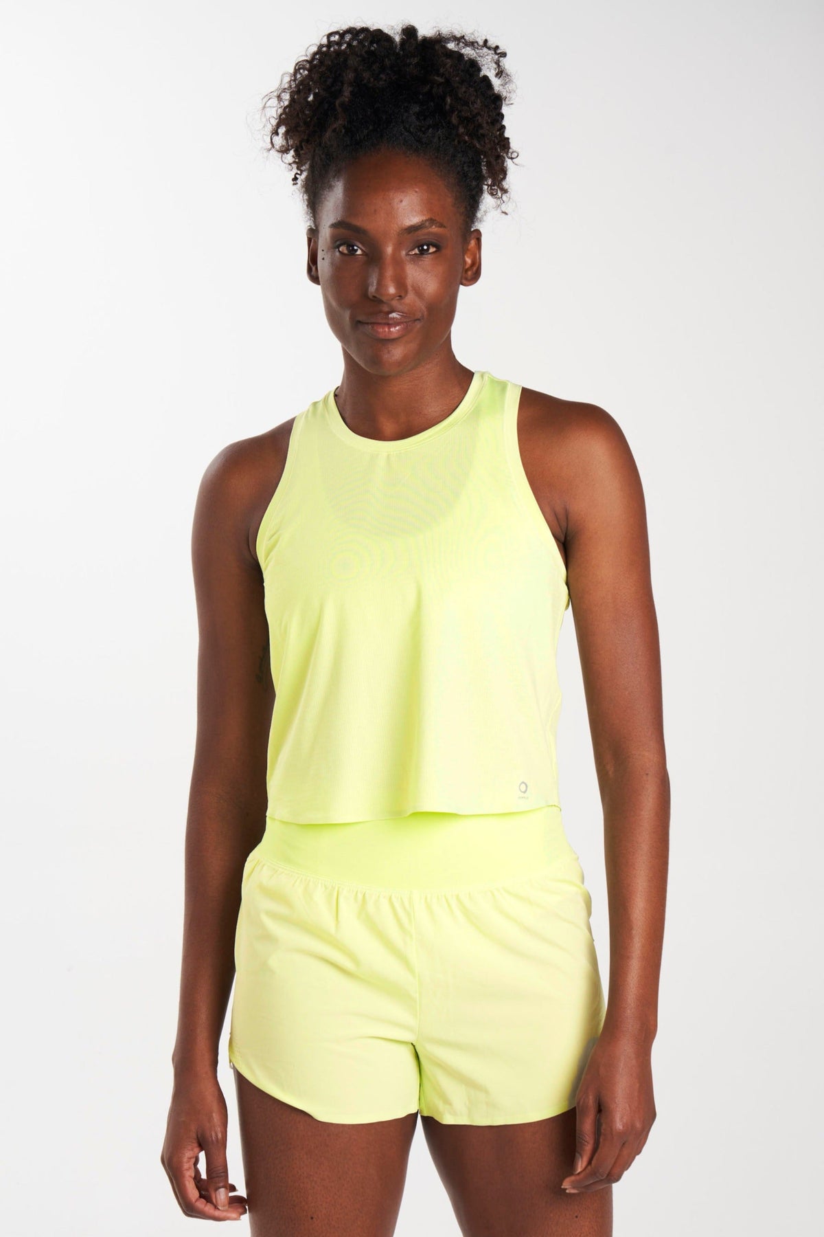 Front view of eco-friendly mesh workout tank top in color stem (yellow). Sustainable activewear for a greener fitness experience.