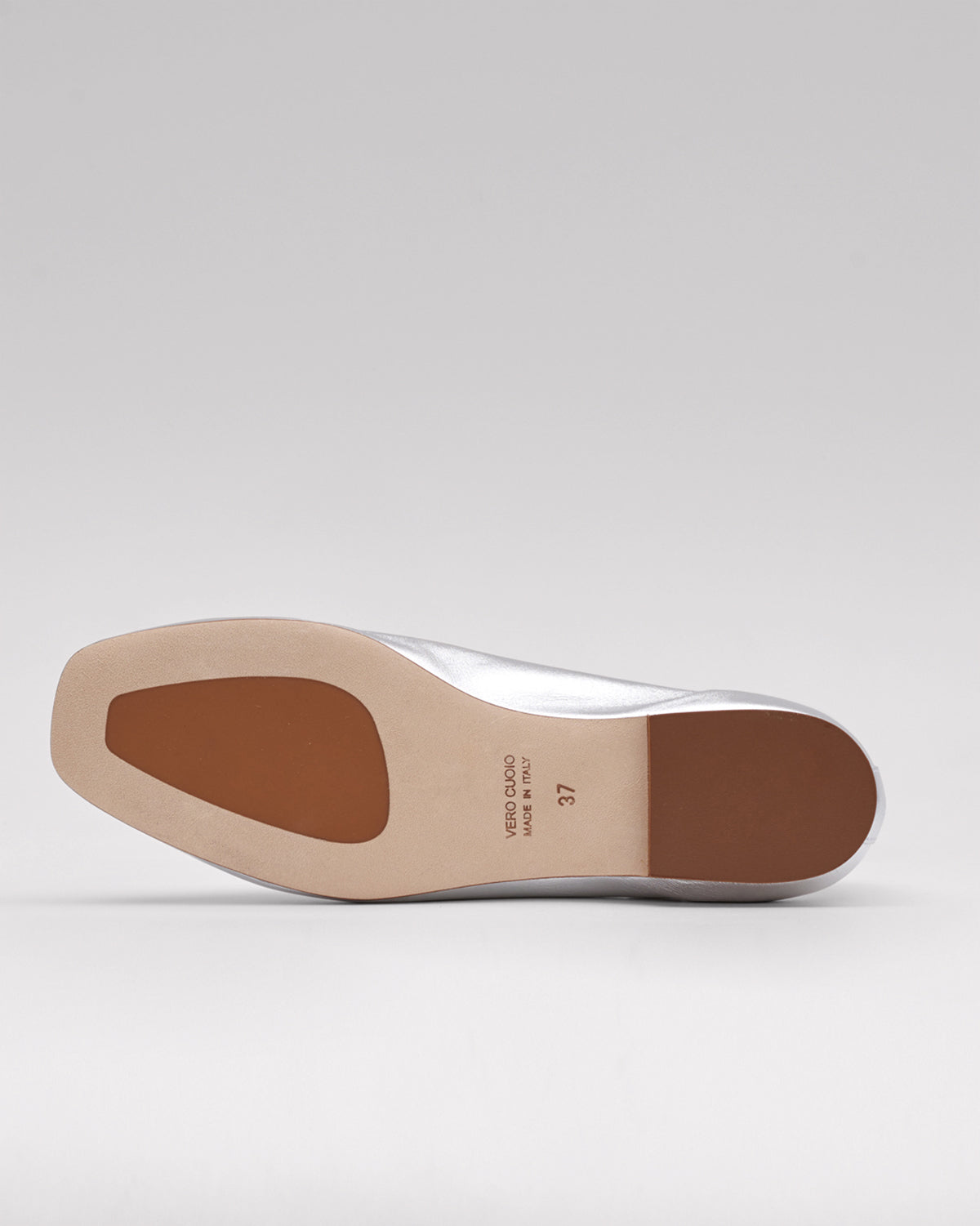 ivory leather flats made from sustainable materials