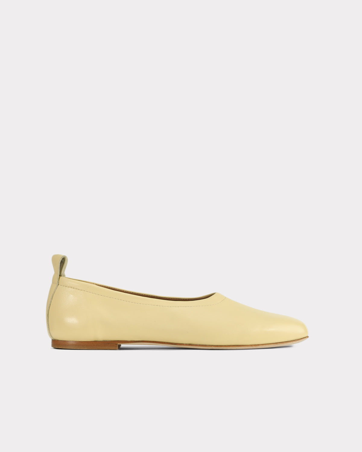 pastel yellow leather flats made from ethical materials