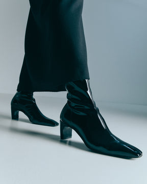 quiet luxury black patent leather ankle boots with kitten heel