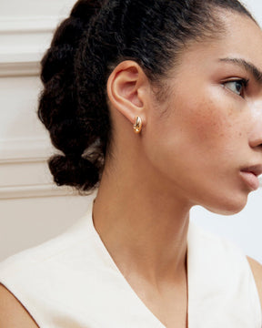 gold huggie earrings made from recycled materials