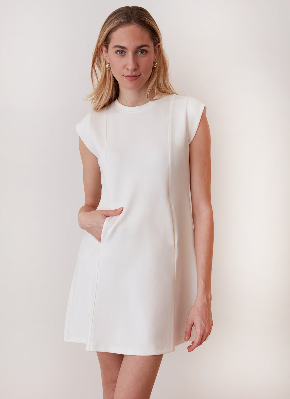 cream summer mini dress with side pockets and cap sleeves