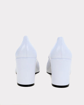 white pointed toe pumps with block heel made from ethical leather