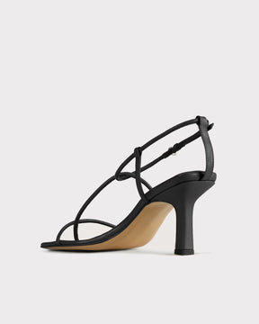 ethical alternative to the row bare sandal black strappy evening shoe