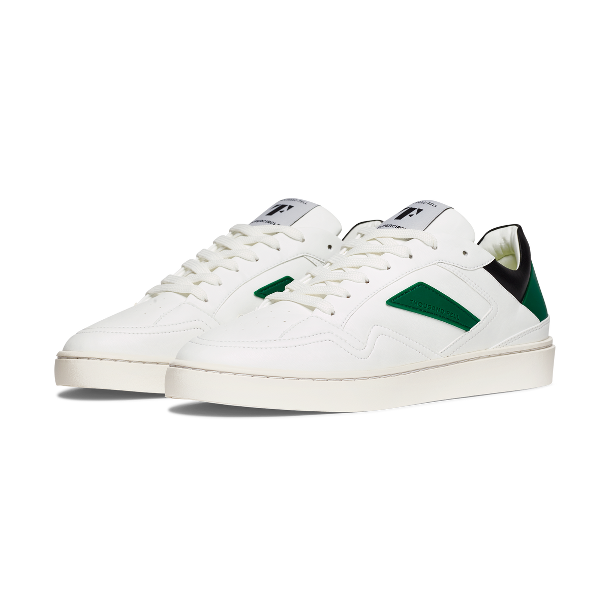 white eco friendly sneakers with black and green details ethical alternative to nike 