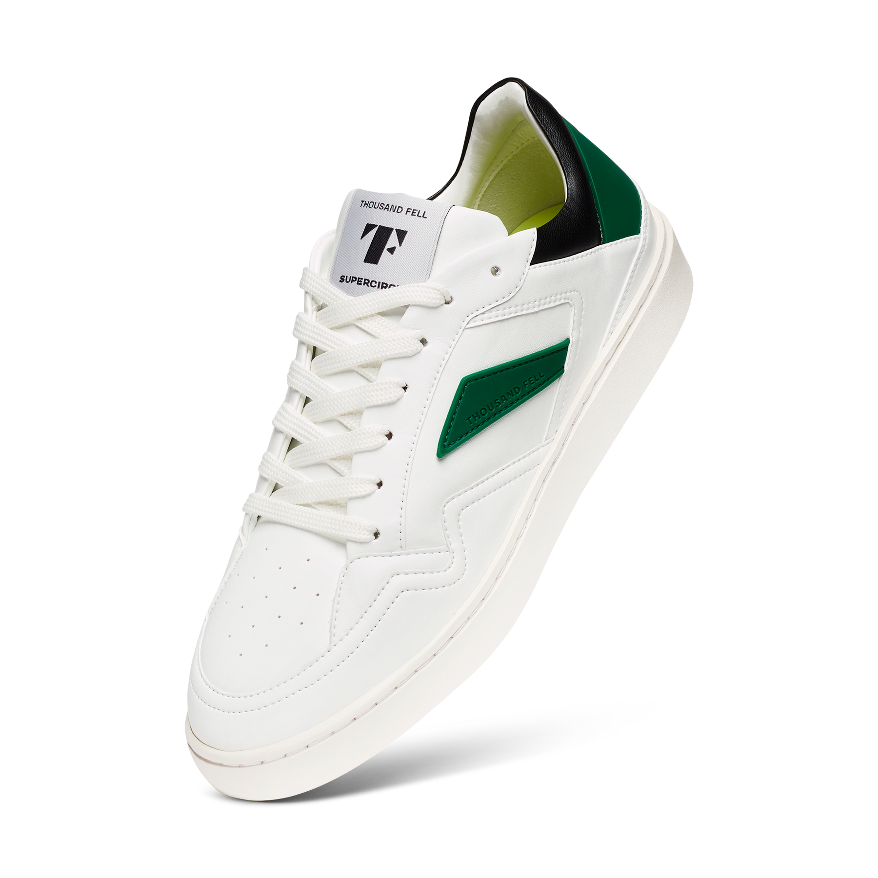 white eco friendly sneakers with black and green features