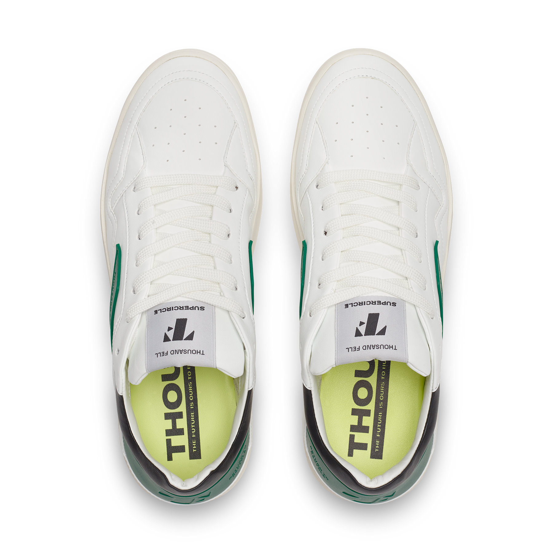 top view of white sneakers with black and green details, ethically made from recycled materials