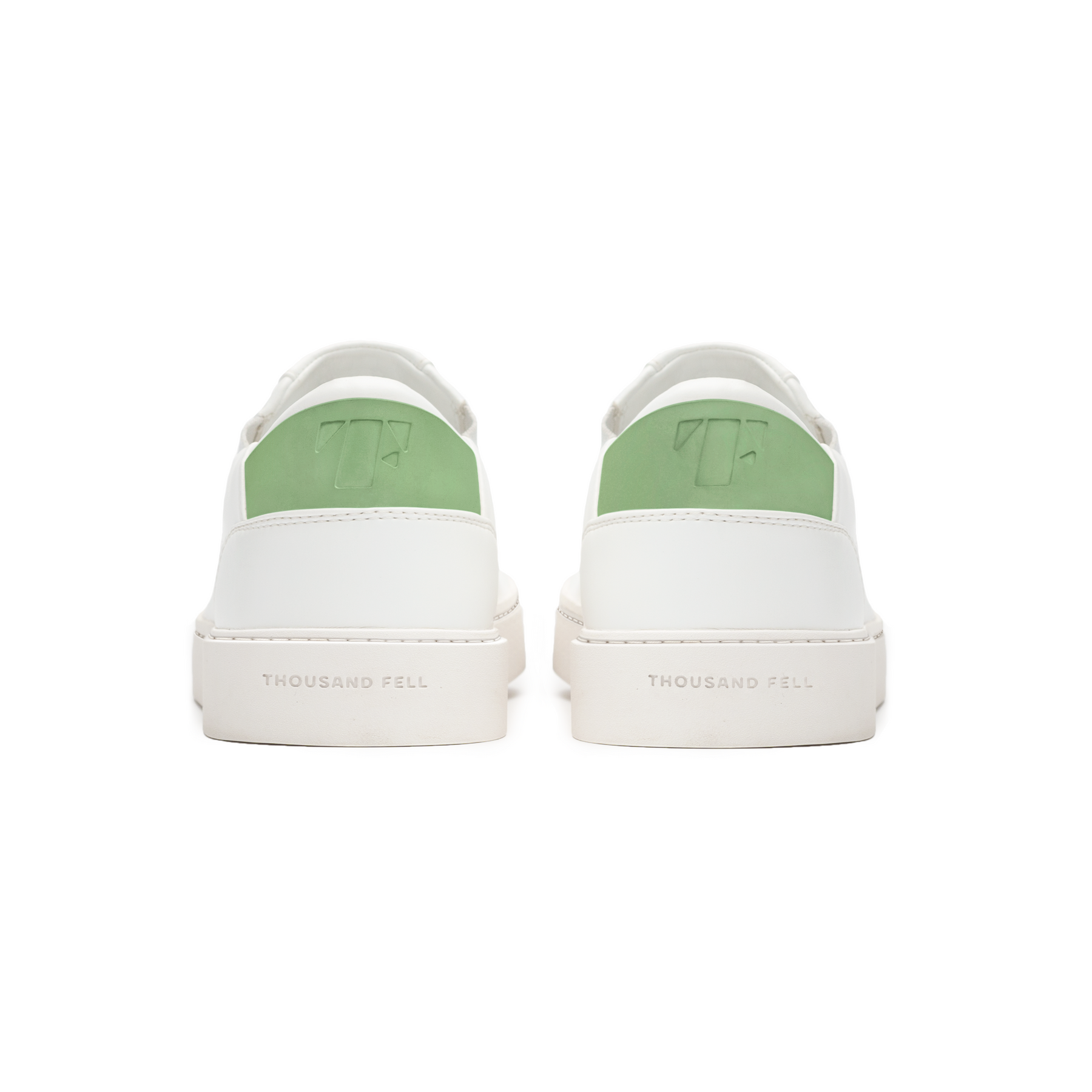 back view of sustainable slip on sneakers in white and green