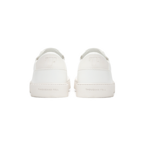 back view of white slip ons made from recycled materials