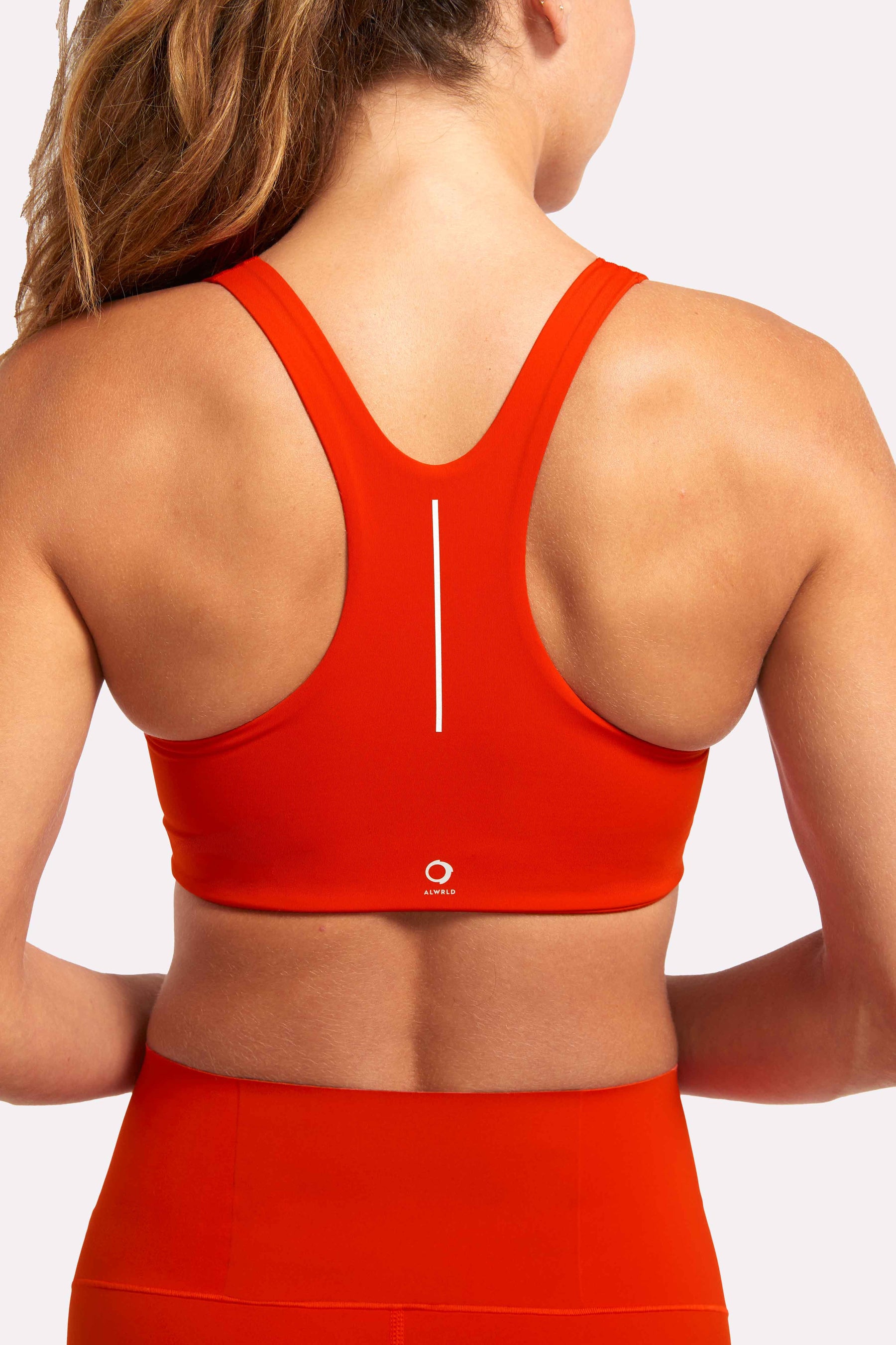 eco conscious racerback sports bra in red