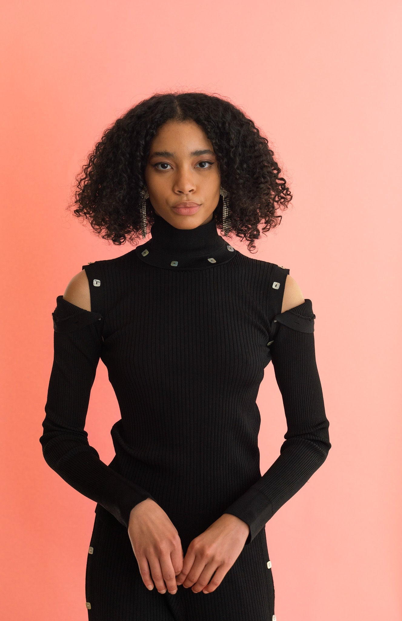 black knit turtleneck with detachable sleeves