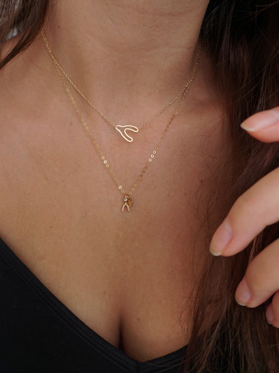 stackable wishbone necklace made from recycled 14k gold