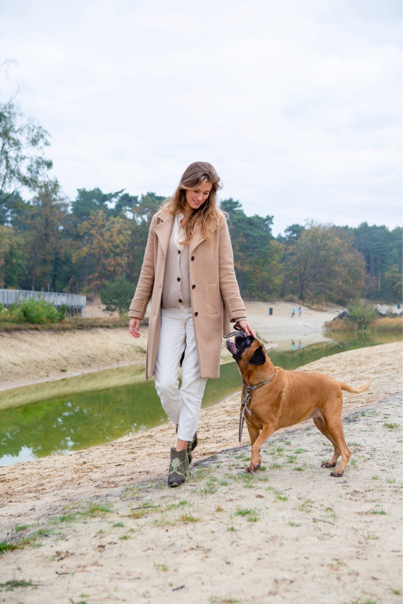 woman wearing western style vegan leather boots in green