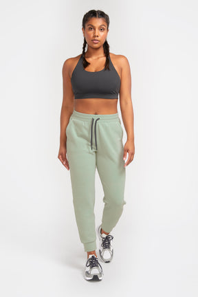 Front view of sage green joggers for running in cold weather