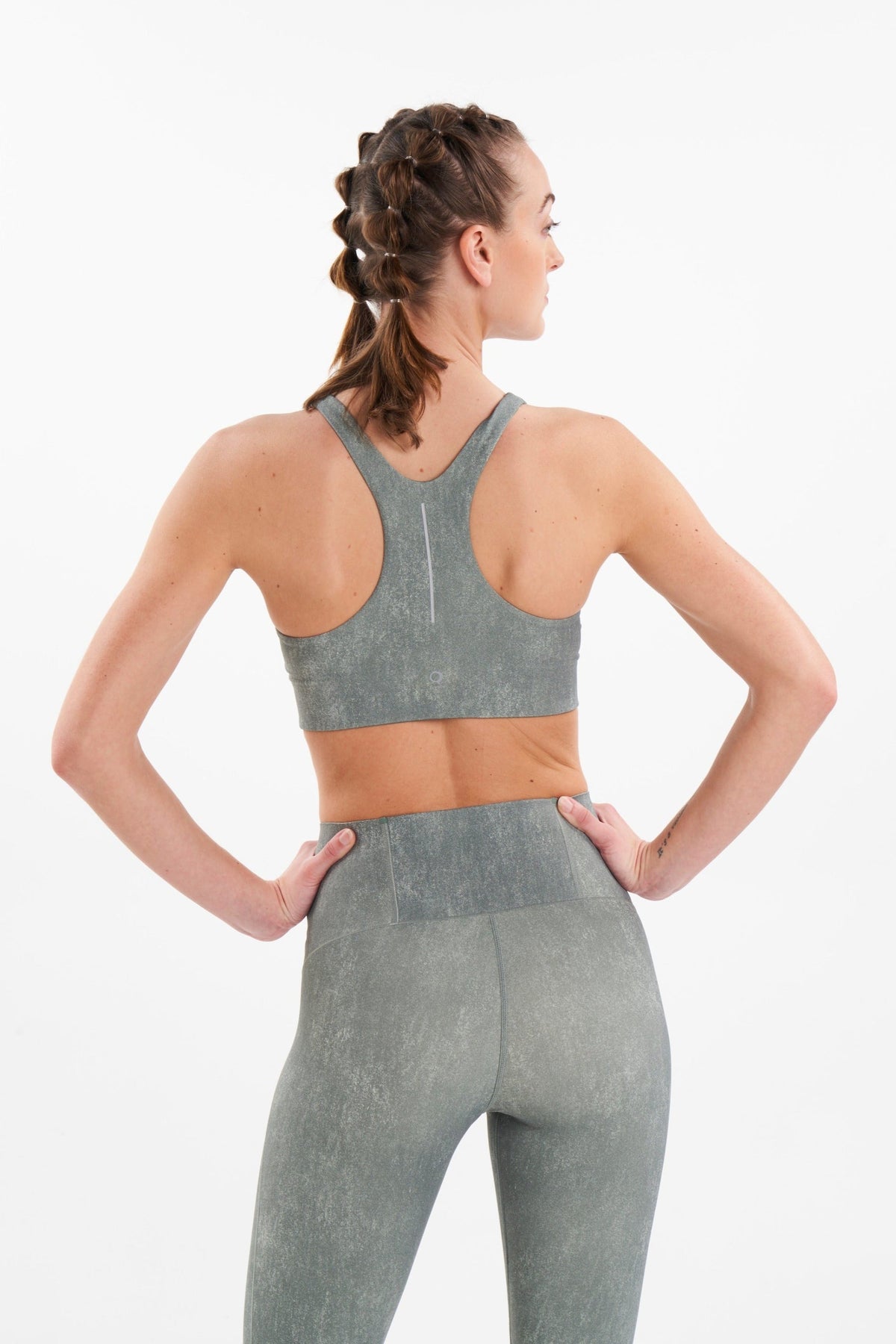 Back view of eco-friendly sports bra with racerback in color weathered fern