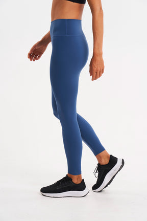 side view of sustainable workout leggings in color blue storm
