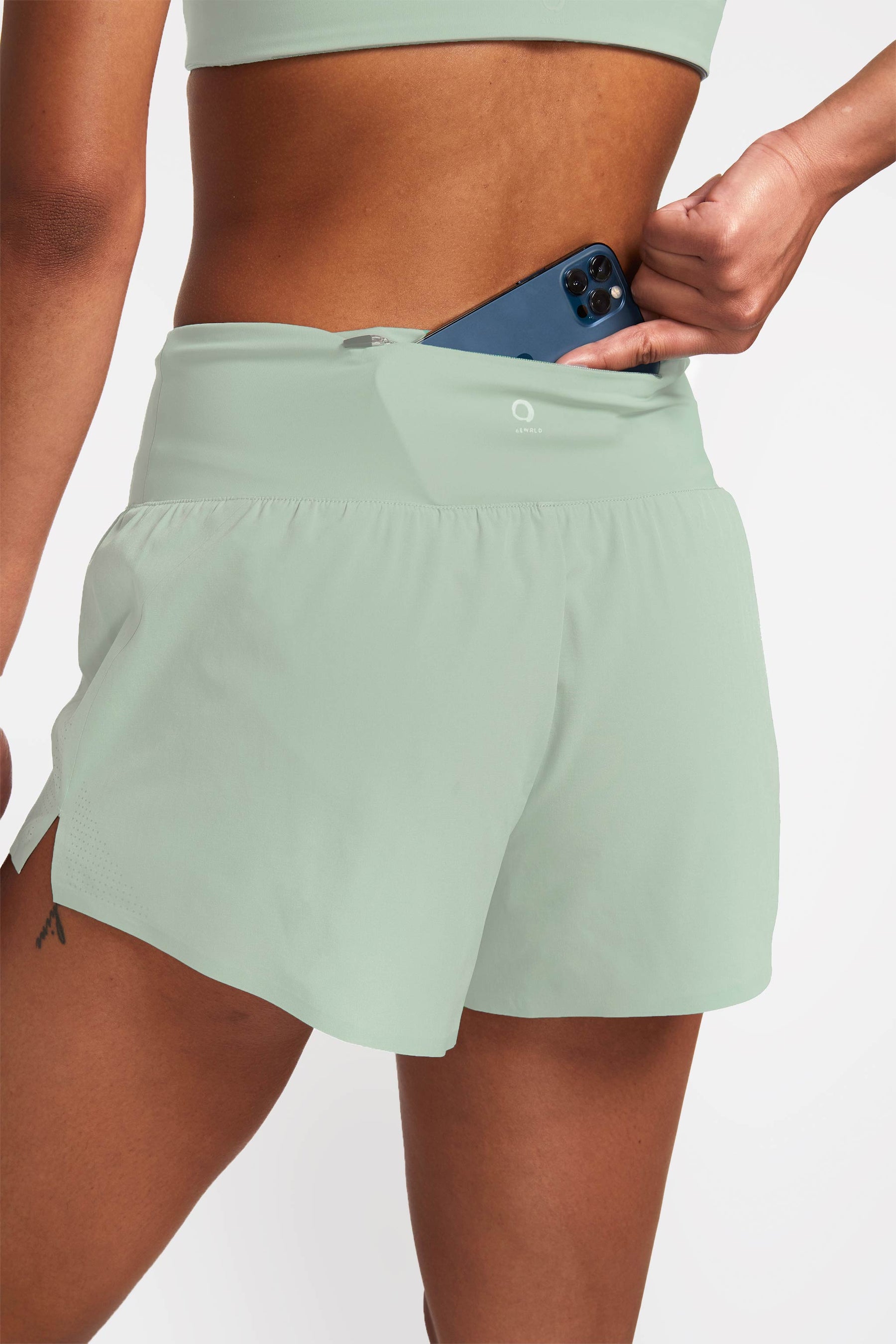 Back view of athletic running shorts with pocket in waistband that fits a cell phone