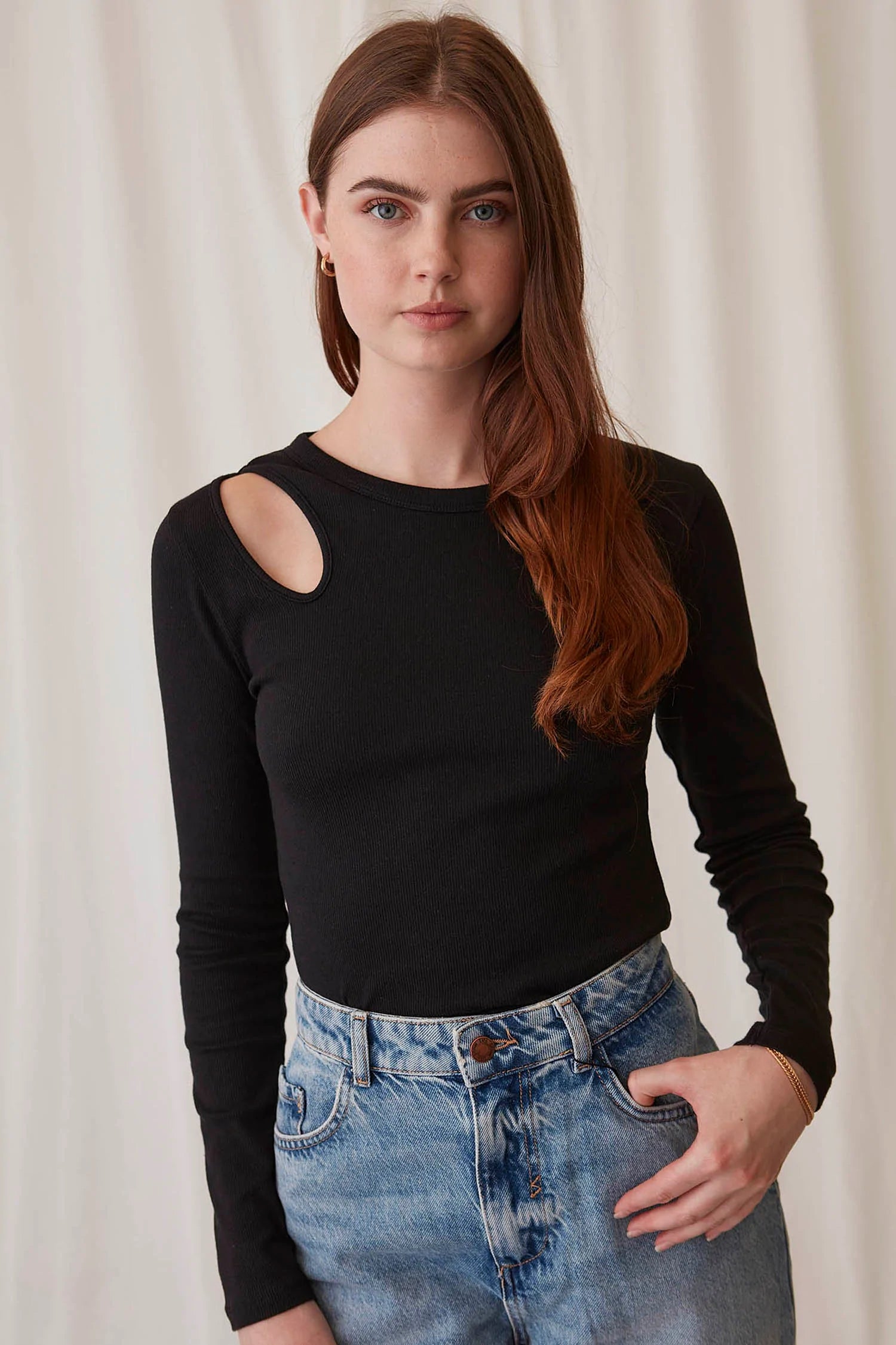 eco chic long sleeve black top with cutout design